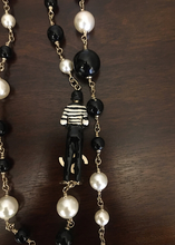 Load image into Gallery viewer, RARE Chanel 100th Anniversary 2010 Cruise 10C Black White Gold Pearl Coco Figure Sautoir 3 Strand Long Necklace